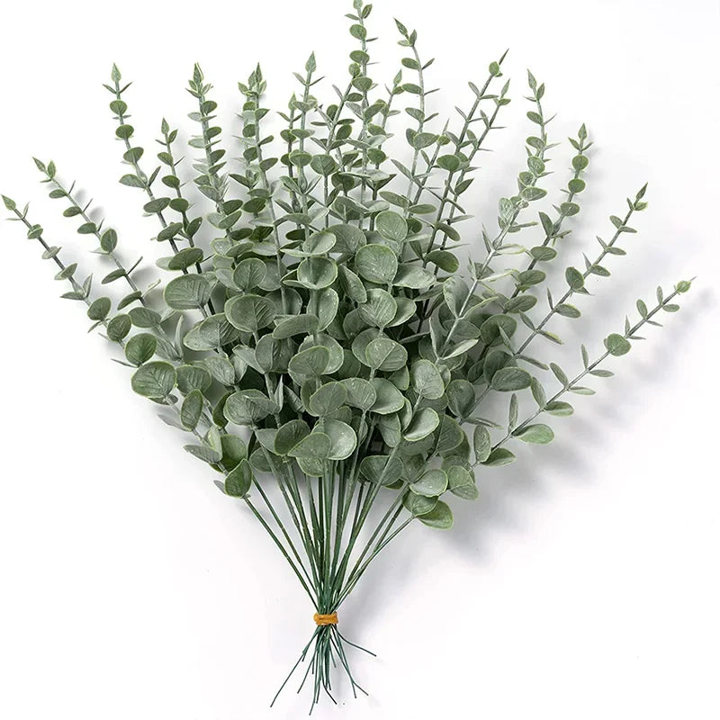 A bunch of artificial baby's breath flowers in a muted green color.