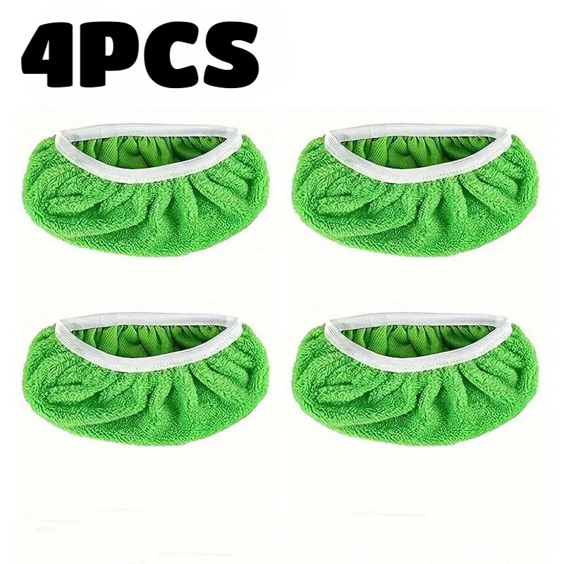 Four reusable green microfiber mop replacement cloths with white trim.