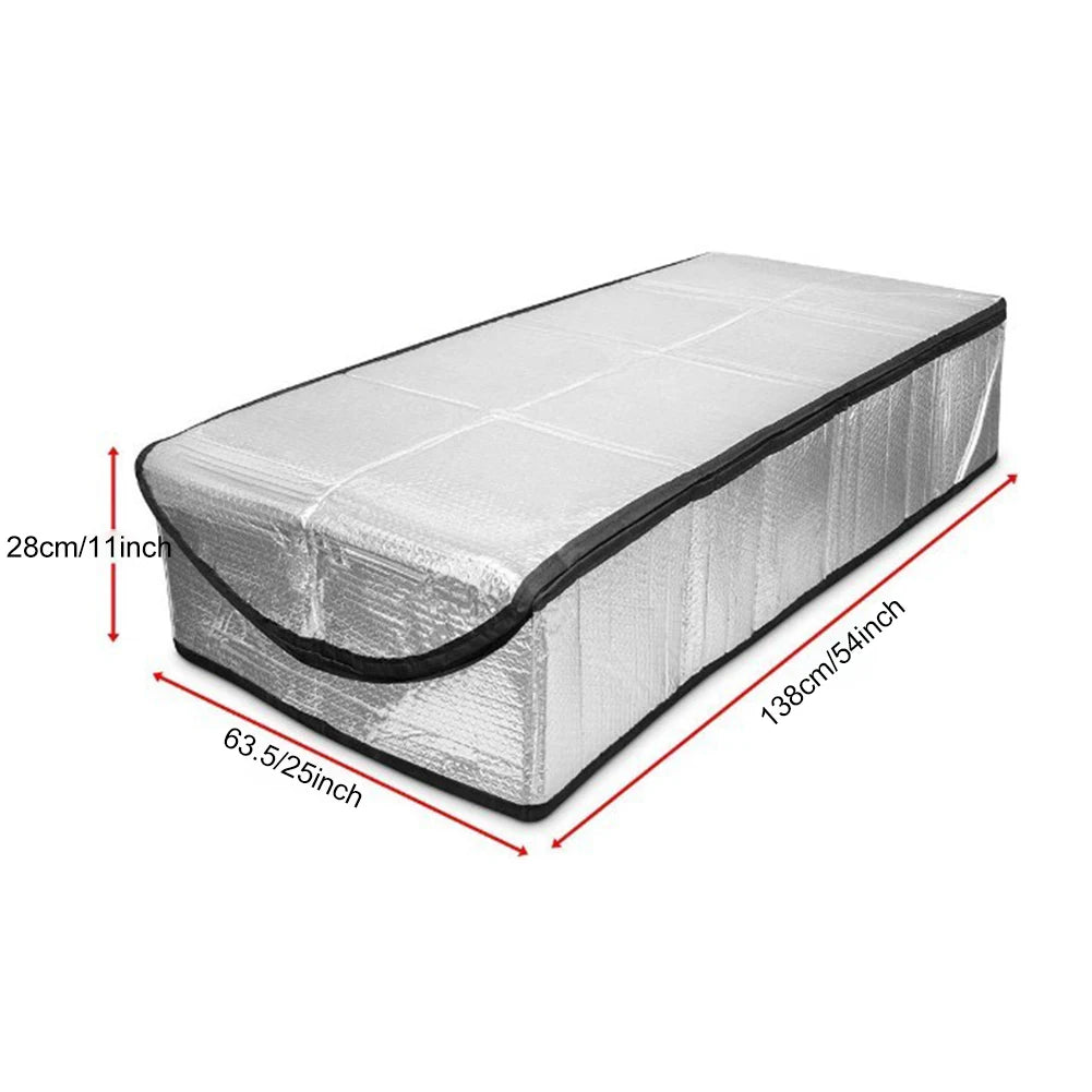 A rectangular attic heat and dust barrier made of silver reflective material with dimensions 138cm x 28cm.