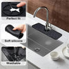 A silicone faucet splash guard mat is shown fitting perfectly onto a kitchen sink and faucet.