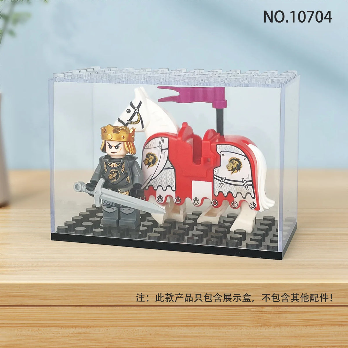 A clear display case featuring a miniature white and red horse figurine.