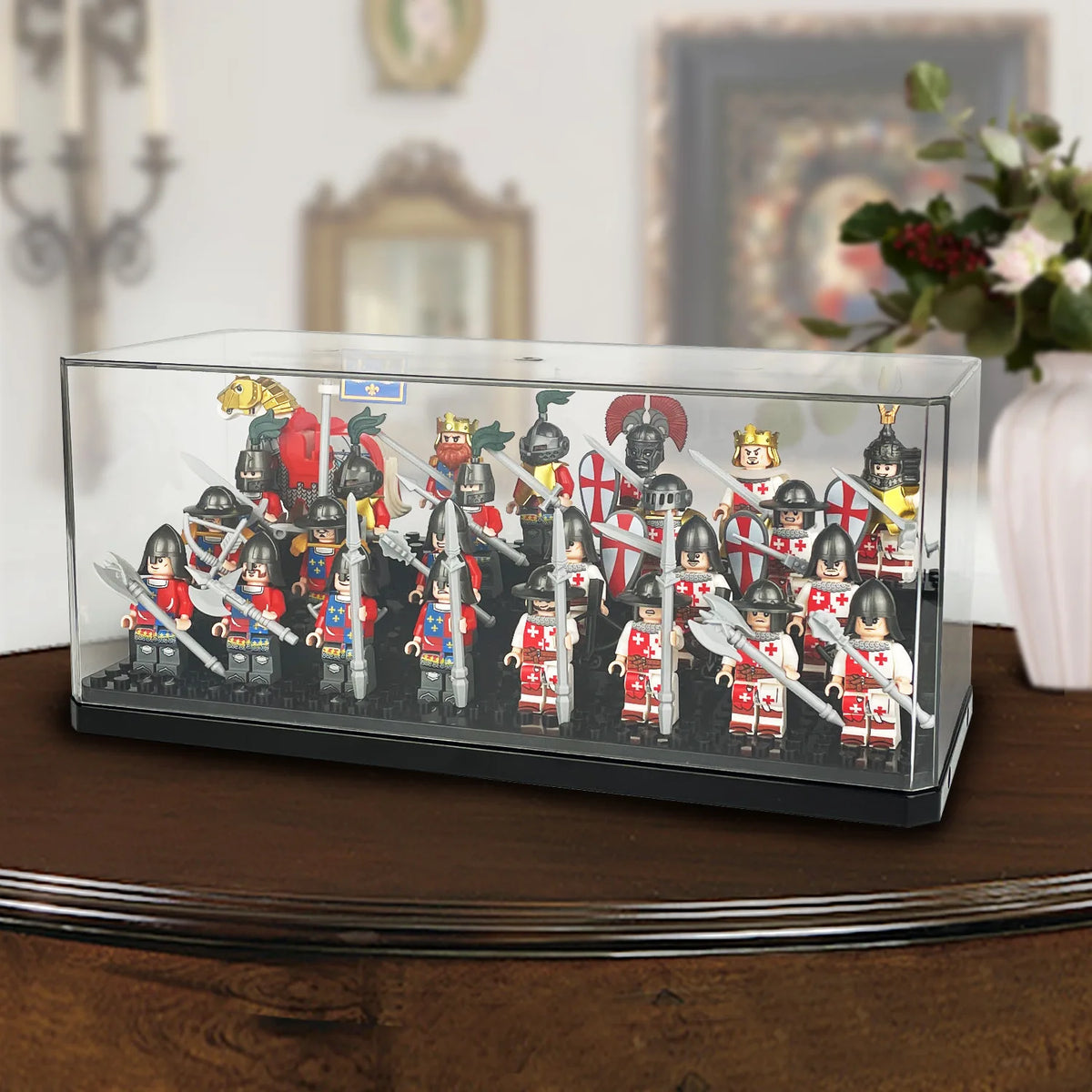 A clear dustproof display case filled with miniature collectible figures of historical soldiers and royalty.