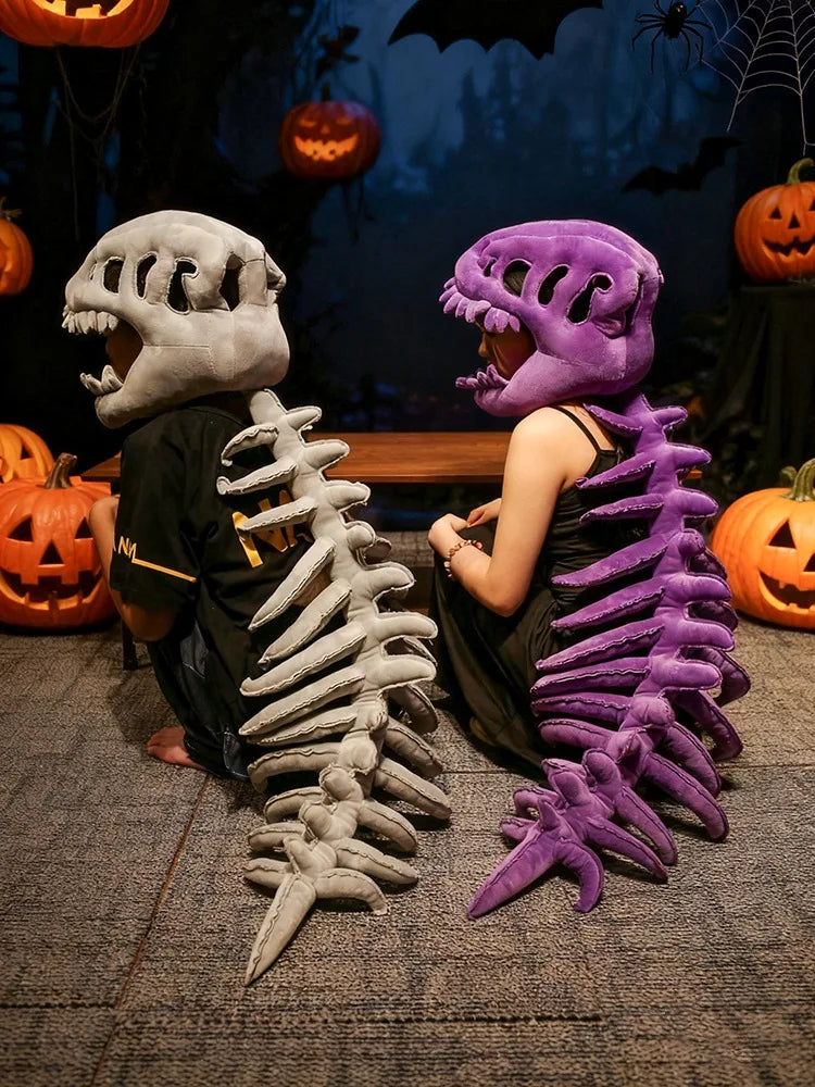 A person wearing a realistic dinosaur skeleton costume set, featuring gray and purple skeletal props, in a spooky Halloween-t