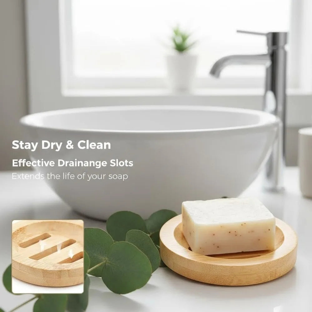 A white bar of soap rests on a natural wooden dish next to a white ceramic sink and faucet.