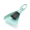 A light mint green mini broom and dustpan set with a handle and bristles for cleaning desks and keyboards.