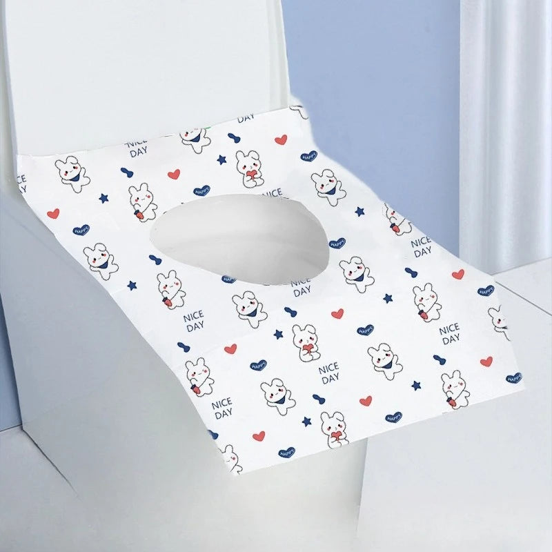A white disposable printing seat cover featuring cute rabbit graphics and nice day text.
