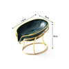 A black decorative leaf soap dish with a gold-colored metal stand.