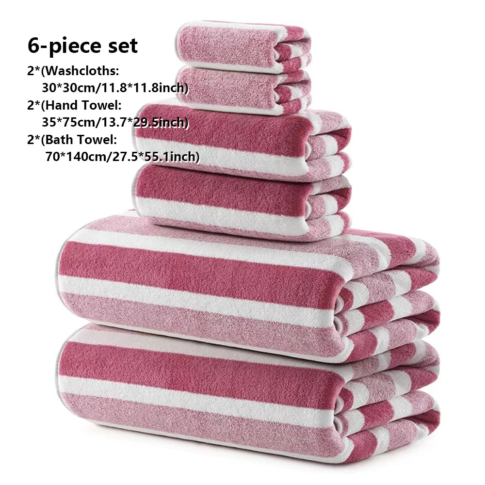Ein Stapel von sechs rosa-weiß gestreiften Handtüchern, einschließlich Waschlappen, Handtücher und Badetücher.