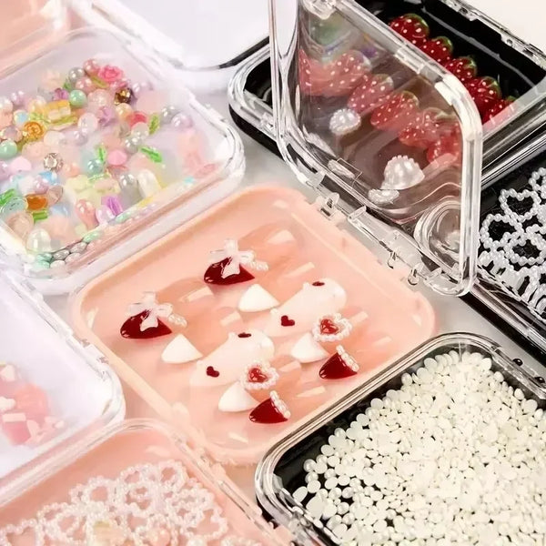 Clear and pink press-on nails displayed in various storage boxes with adhesive display tape.