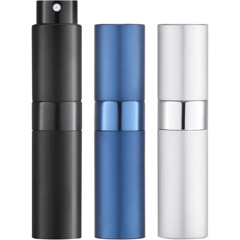 A set of three travel perfume atomizers in black, blue, and silver.