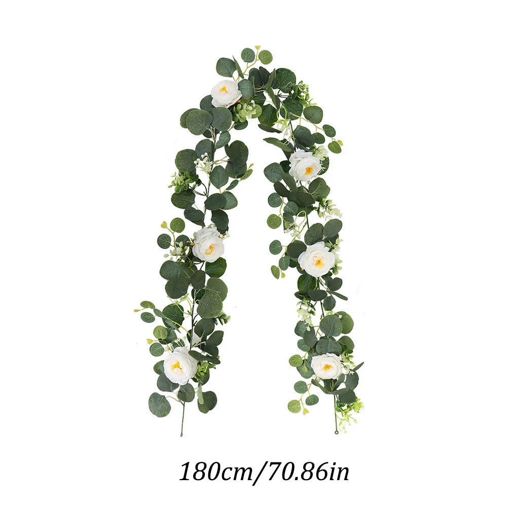 An arching garland made of artificial eucalyptus leaves and white roses, measuring 180cm or 70.86in.