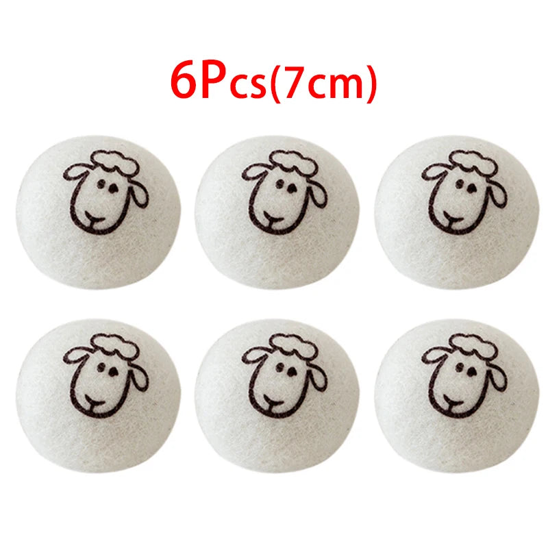 Six white wool dryer balls with a sheep design printed on them.