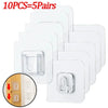 Ten pairs of white double-sided adhesive wall hooks shown in a stack and close-up view
