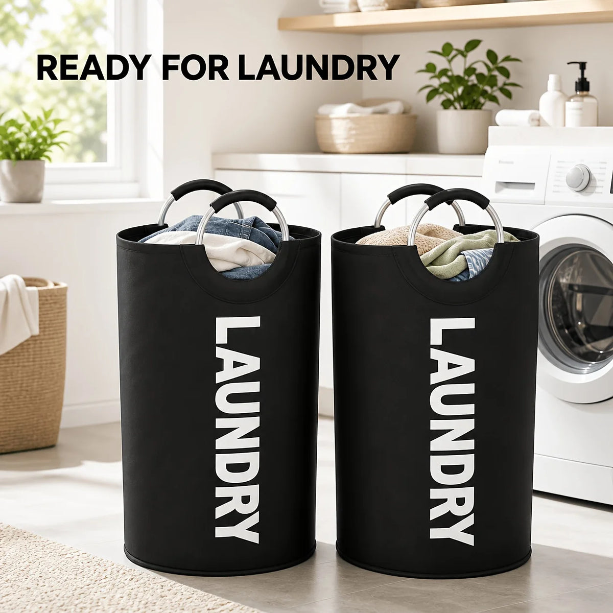 A pair of black fabric laundry hampers with white text Laundry on them, sitting on a light-colored floor.