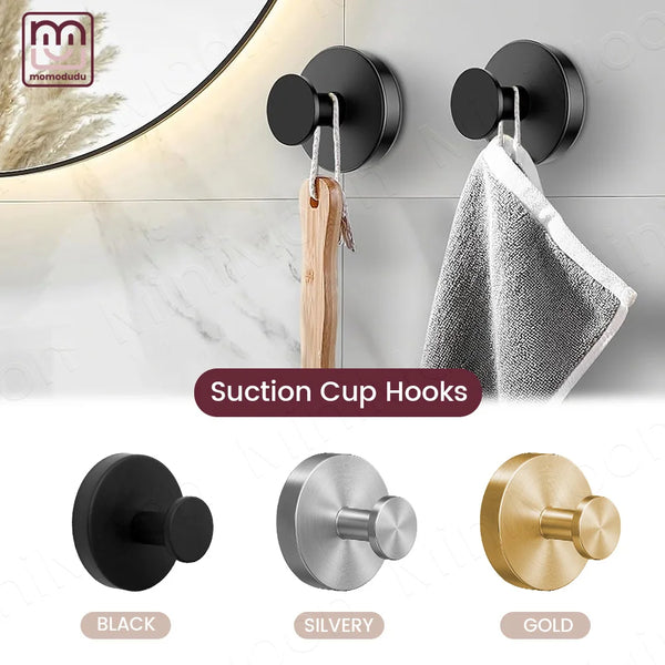 Three suction cup hooks in black, silvery, and gold finishes shown against a white background.
