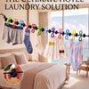 A portable travel clothesline featuring 12 colorful retractable clothespins displayed against a window view.