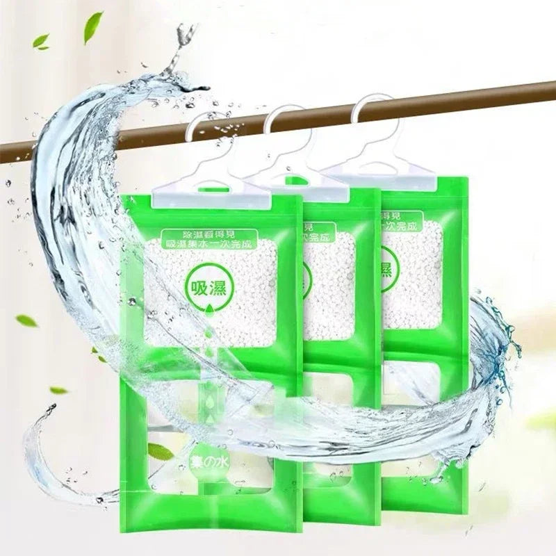 Green hanging bags filled with moisture absorbers are shown hanging from a wooden bar.