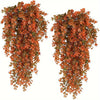 Artificial flower garland featuring reddish-orange leaves cascading down