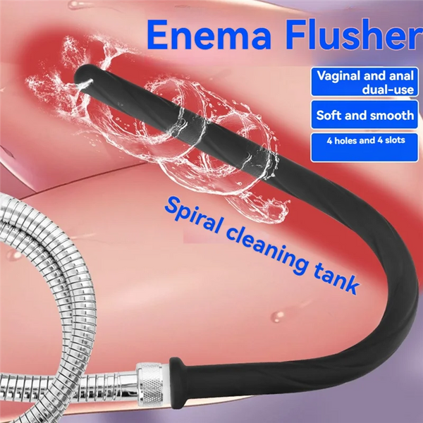 A black enema flusher with a silicone hose is shown inside a pink cleaning tank.