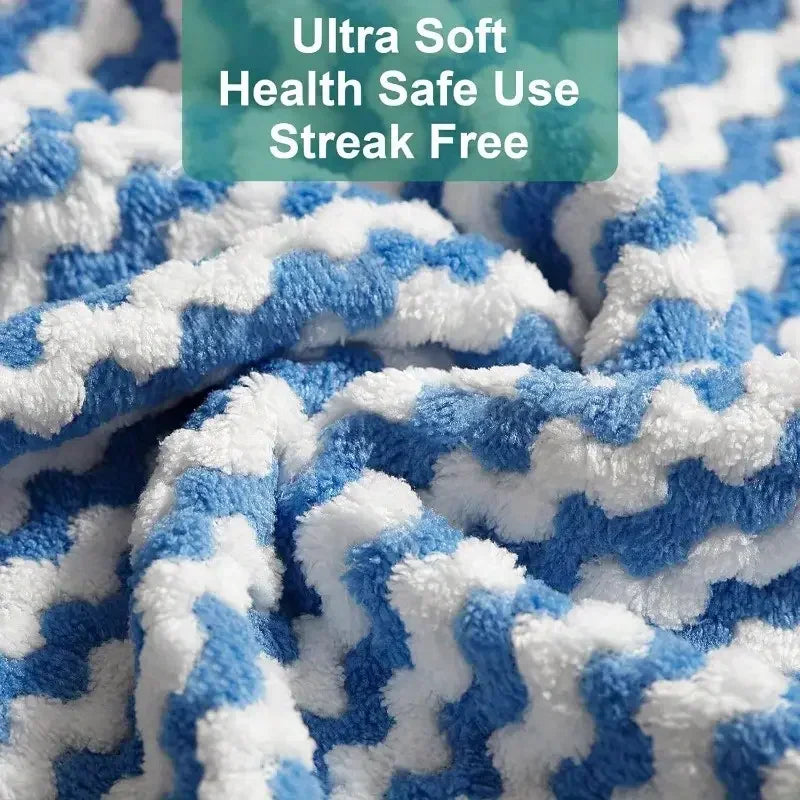 Close-up of a blue and white microfiber cleaning cloth with a zigzag pattern.