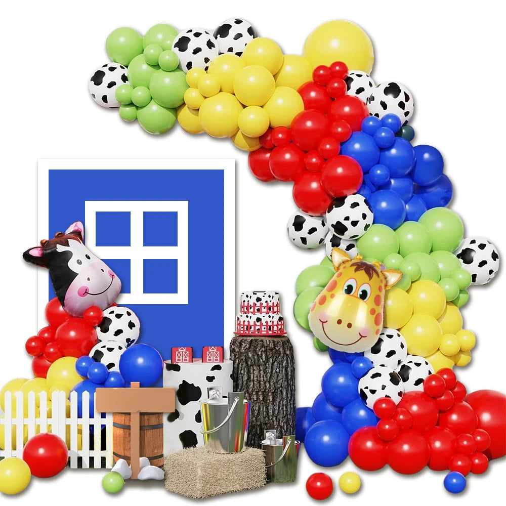 A colorful balloon garland featuring yellow, green, red, and blue balloons with cow print patterns.