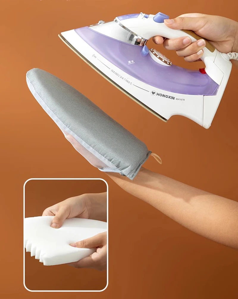 A hand is using a heat resistant ironing pad with a steam iron to press fabric.