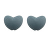 A pair of smooth, heart-shaped silicone charm beads in a solid gray color.