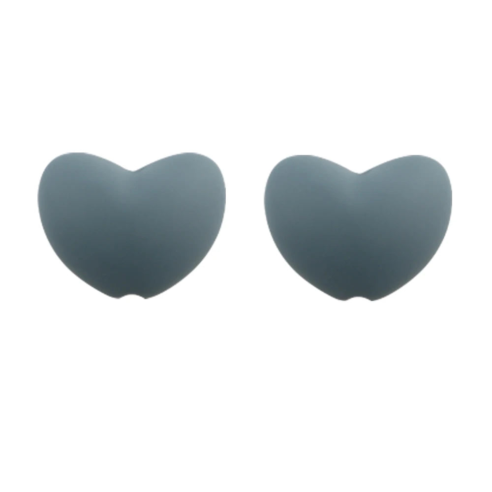 A pair of smooth, heart-shaped silicone charm beads in a solid gray color.