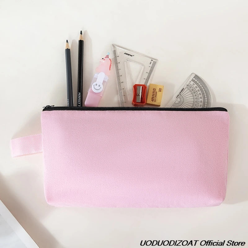A pink zippered pouch containing various tools like pencils, a ruler, and small items for storage.