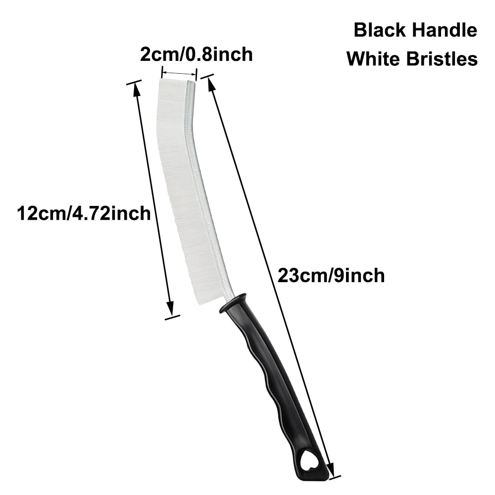 A black handle crevice cleaning brush with white bristles and a 12cm length.