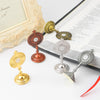 A set of mini metal religious ornaments featuring a cross design in gold and silver tones.