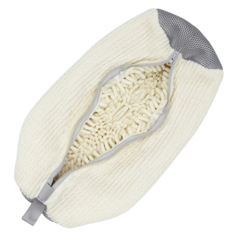 A cream-colored storage bag for shoe cleaning tools with a gray lining and visible brush bristles.