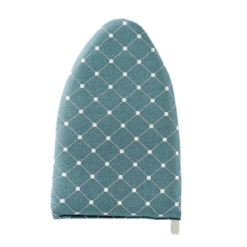A teal quilted ironing board with a diamond pattern and a white handle.
