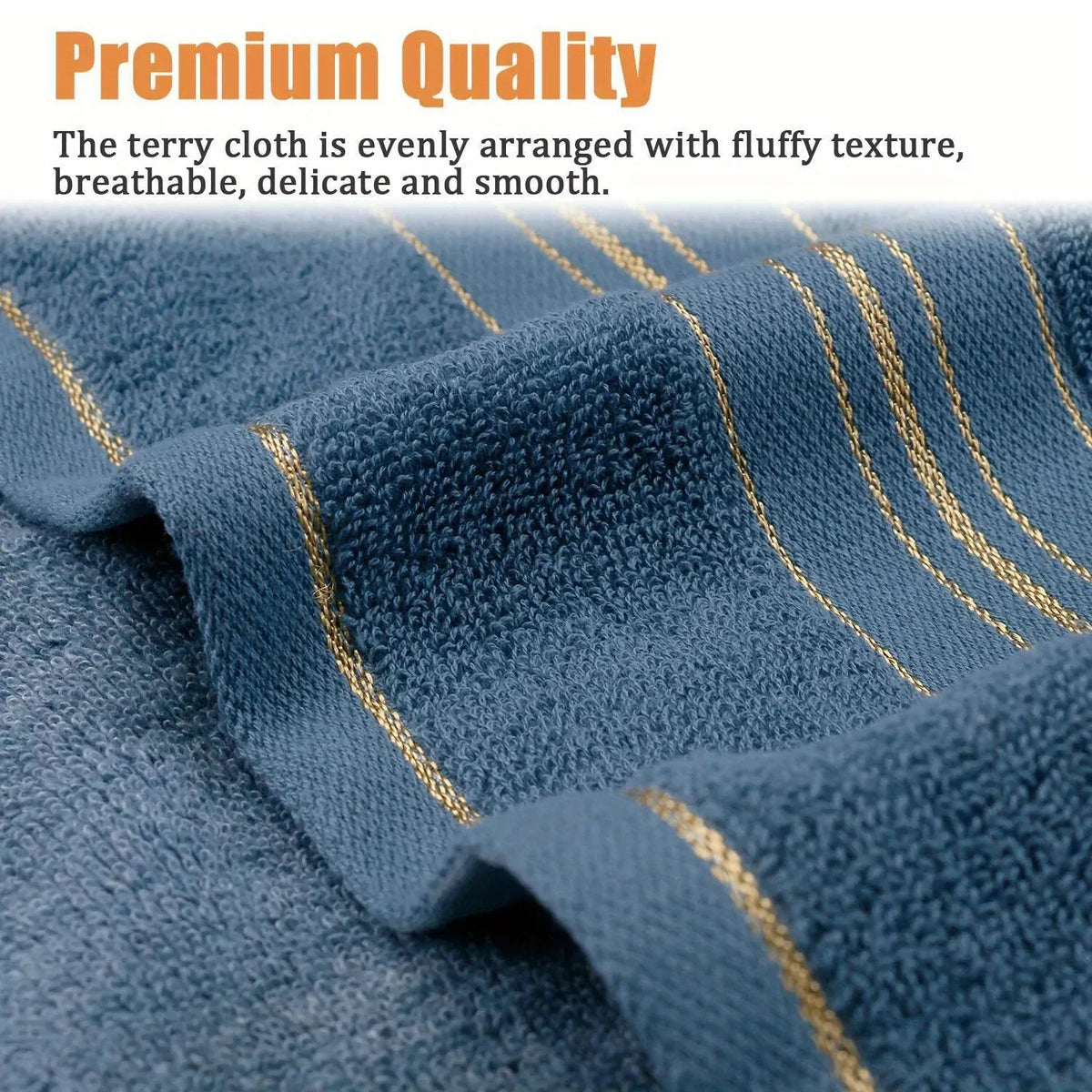 Close-up of a blue terry cloth bath towel with gold stripes, showing its fluffy texture.