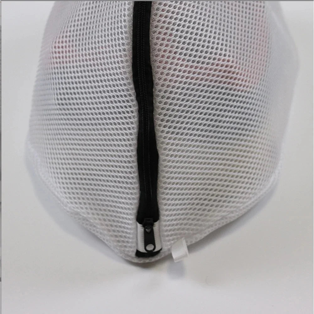 White mesh laundry bag with a black zipper closure shown from the top view.