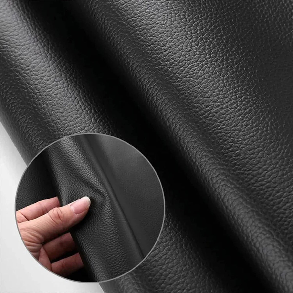 Close-up of black heavy-duty waterproof PU leather material showing texture and thickness.