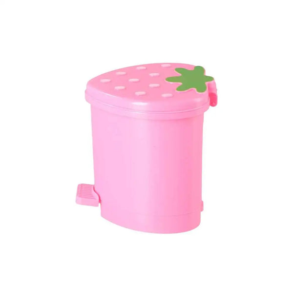 A pink reusable strawberry decorative trash can with a green lid.