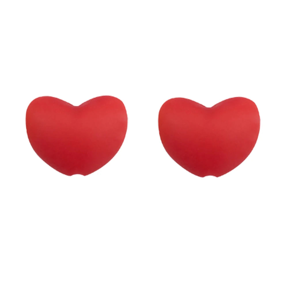 A pair of bright red silicone heart charm beads for DIY jewelry.