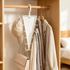 A wooden closet organizer displaying various clothing items and accessories hanging on multi-hook hangers.