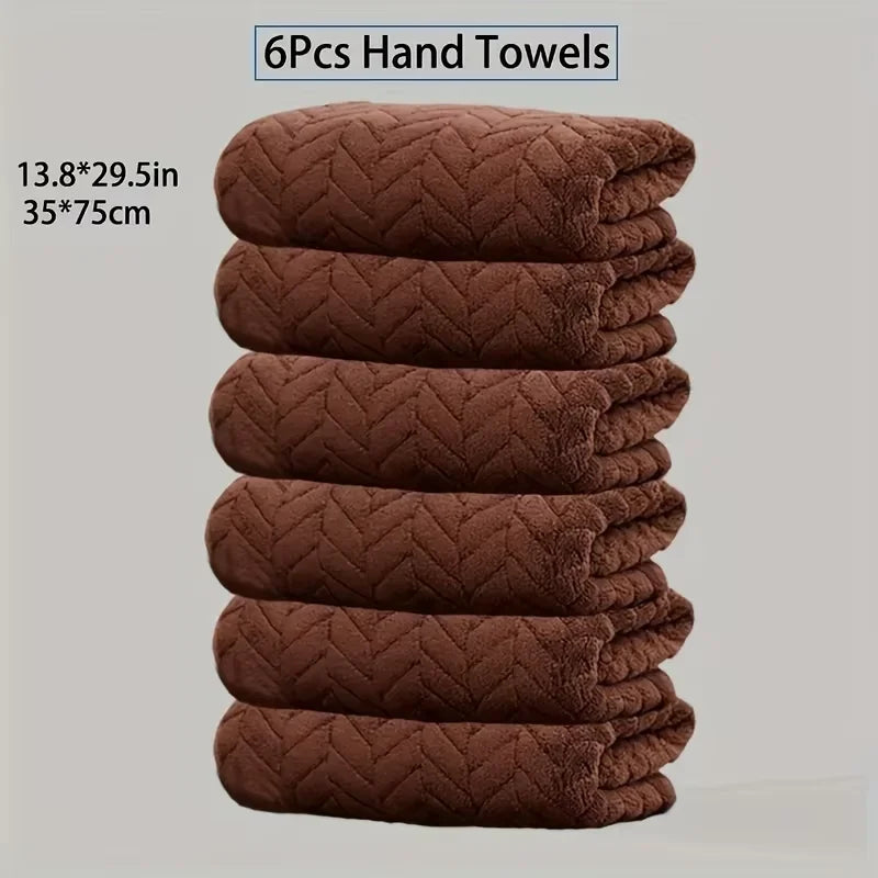 A stack of six brown quilted hand towels, measuring 13.8 x 29.5 inches each.