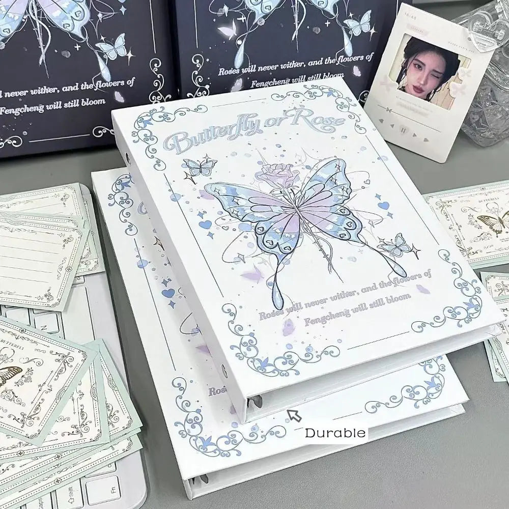A white photo album featuring butterfly and rose designs with elegant floral illustrations.