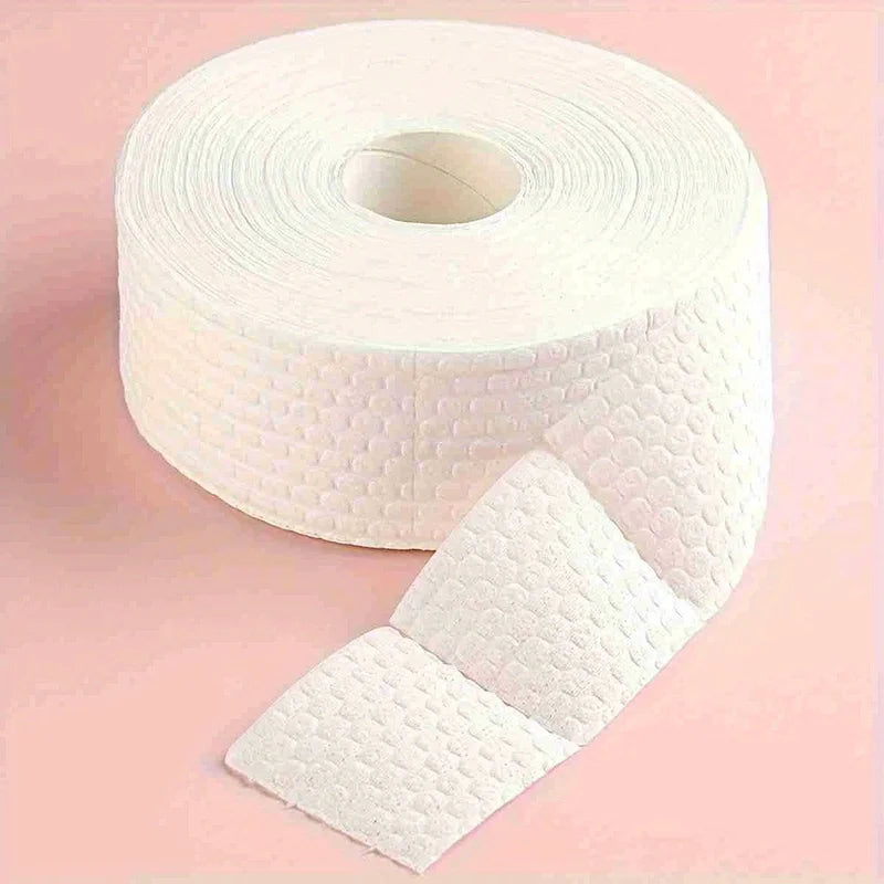 A roll of white professional cotton pads for nail and gel polish removal