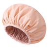 A light peach reusable satin lined shower cap shown from above.