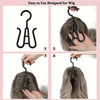 A set of black plastic wig hangers shown in various stages of use for styling hair.