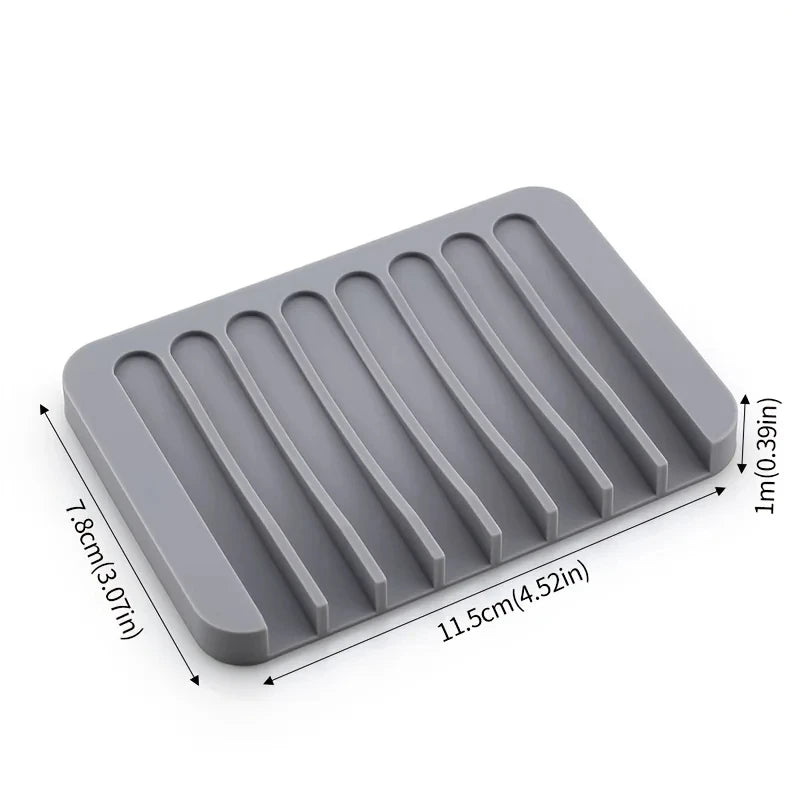 A gray silicone soap dish with ridges and an anti-slip base, measuring 11.5cm by 7.8cm.