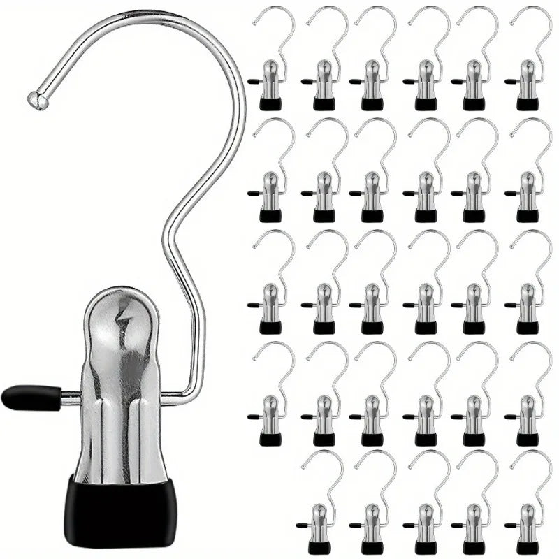 A set of premium stainless steel clothes pegs and hooks with black bases.