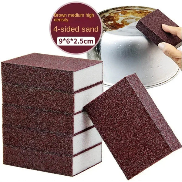 A stack of brown medium density 4-sided sand cleaning sponges next to a loose sponge and a hand.