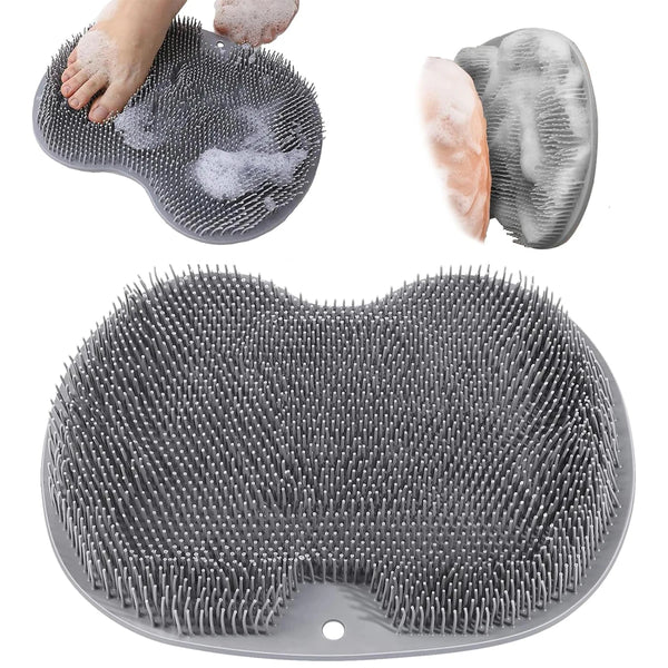 A gray wall mounted shower foot scrubber is shown with a hand and a sponge, and the full scrubber product.