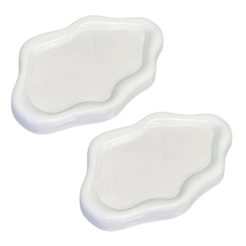 A white cloud-shaped jewelry organizer tray with a slightly wavy, organic edge.