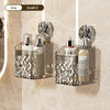 A clear glass storage rack with suction cups holds several bottles and a rollerball perfume, set against a light beige backgr